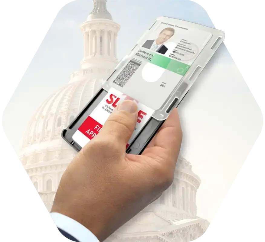A hand slides open a shielded card holder covering a government ID