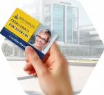 A hand holds a healthcare / hospital employee ID card
